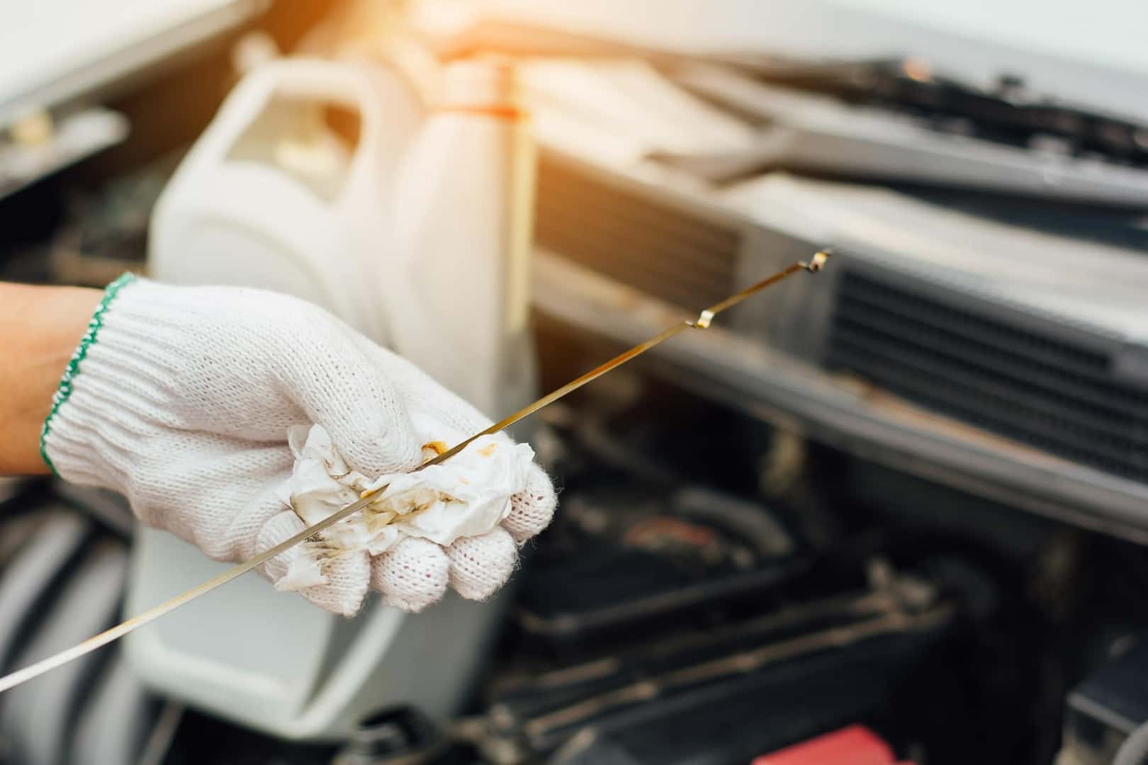 Acura technician performing an oil change 