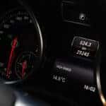 Used car mileage on digital dashboard for evaluating optimal mileage