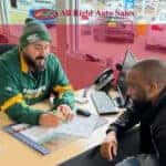 All Right Auto Sales team member assisting a customer in Federal Way, WA