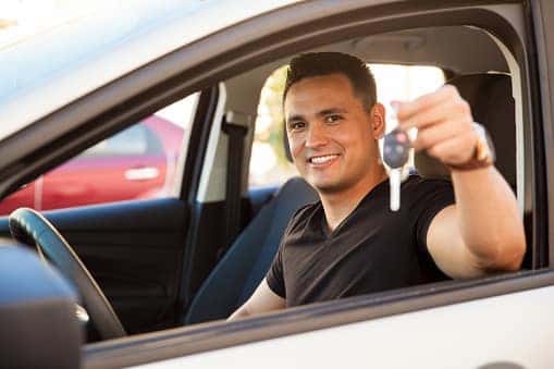 Man with new car