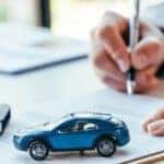 auto financing banner showing a financing expert in Waukehsa, WI approving an auto loan