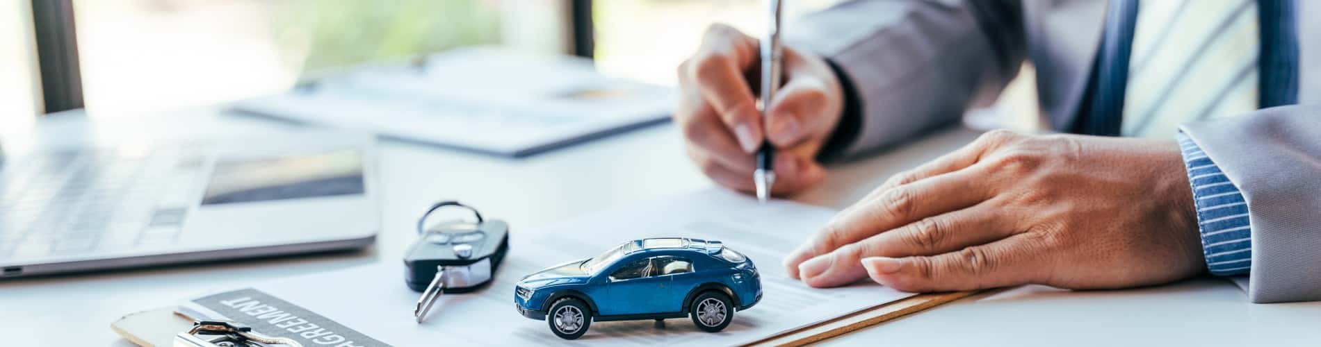 auto financing banner showing a financing expert in Waukehsa, WI approving an auto loan