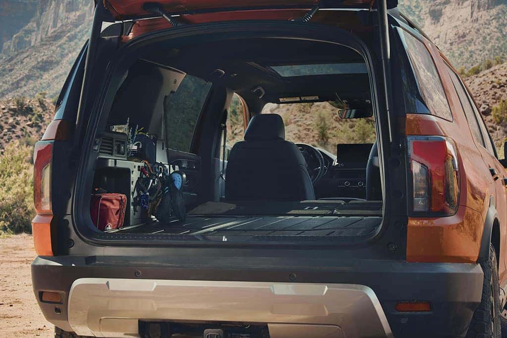 2026 Honda Passport TrailSport with back open showing off cargo space with seats folded down
