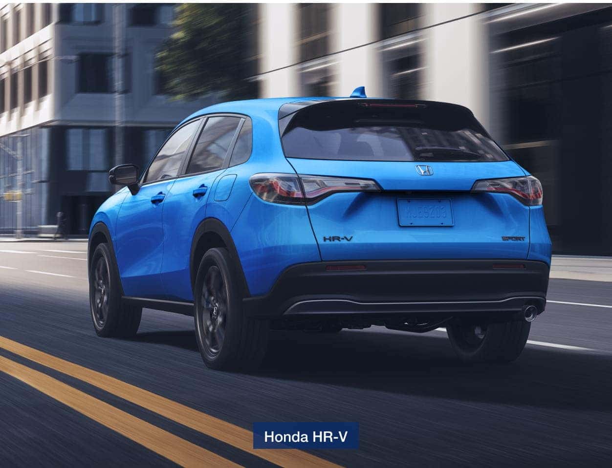 2026 Honda HR-V is driving on a city street.