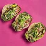 3 soft shell tacos pink background