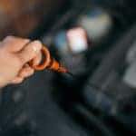 checking oil dipstick
