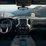gmc sierra dashboard, steering wheel, console, and glove box