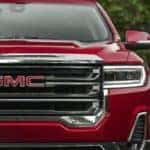 2021 GMC Acadia SLT AWD in Cayenne Red Tintcoat Showing Grill:Grille and Headlamp