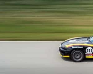racecar driving on a tracetrack