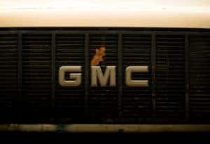 GMC logo with a leaf over the M