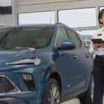 Buick Service Technical talking with customer