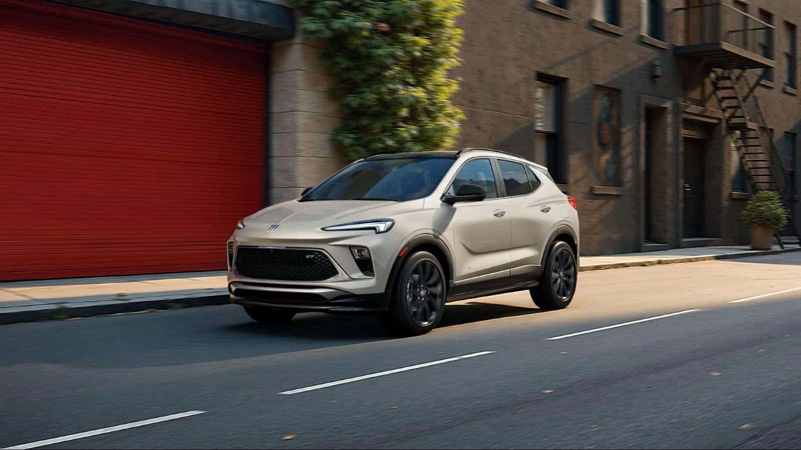 Buick Encore GX driving down a road