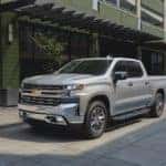 silver chevy silverado 150 on city street