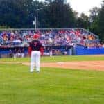 baseball player waiting to bat at a minor league game