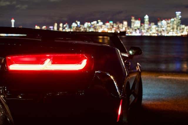 black convertible looking over the city