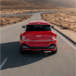 EV driving on a desert road.