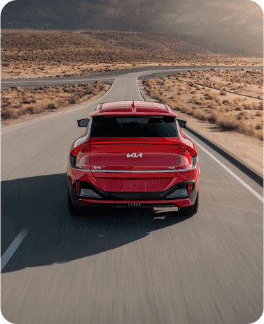 EV driving on a desert road.