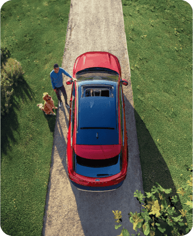 Overhead view of a EV parked in a driveway.