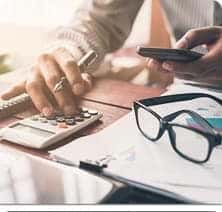 Finance person using calculator