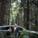 A man and young child in the woods with a 2020 Mazda CX-9 - El Dorado Mazda in McKinney, TX