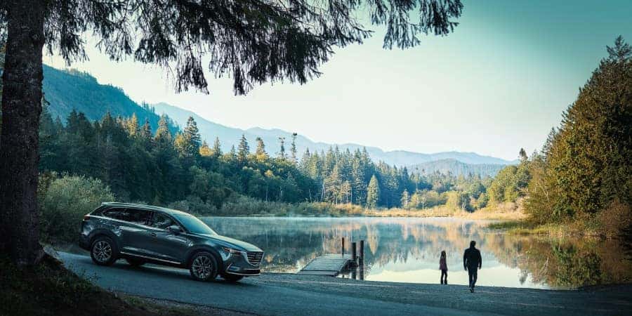 A 2020 Mazda CX-9 parked next to a lake | El Dorado Mazda in McKinney, Texas