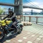 person riding harley davidson livewire on city deck