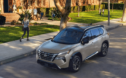 2026 Nissan Rogue parked on a tree-lined residential street