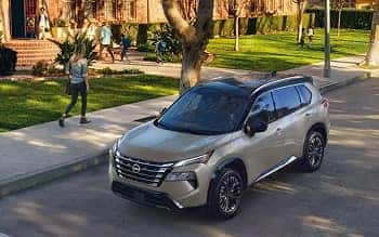 2026 Nissan Rogue parked on a tree-lined residential street