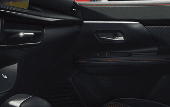 Kicks interior door panel with red stitching accents