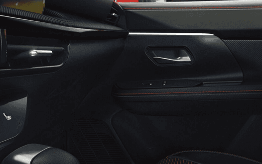 Kicks interior door panel with red stitching accents