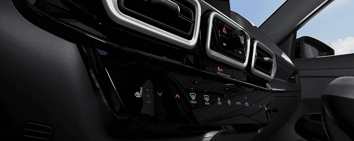 Close-up of Sentra center stack with climate and heated-seat controls