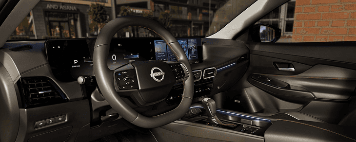 Sentra driver-side cockpit with steering wheel, dual displays, and center stack