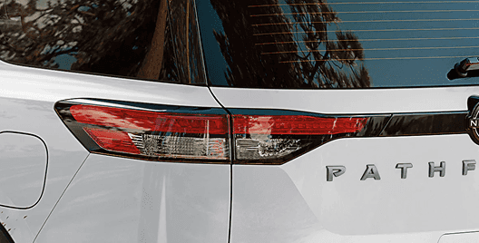 Close-up of the white Pathfinder rear tail light and PATHFINDER badge