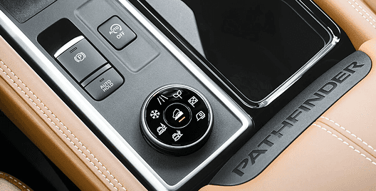 Close-up of Pathfinder drive mode selector dial and electronic parking brake