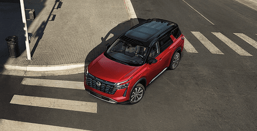Top-down view of a red Pathfinder at a crosswalk intersection