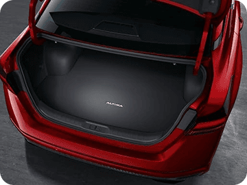 Open trunk of red Nissan Altima