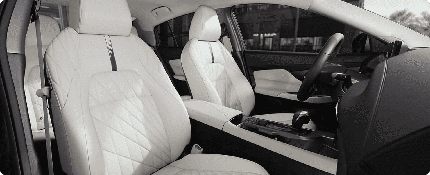 Sentra front cabin with white quilted leather seats