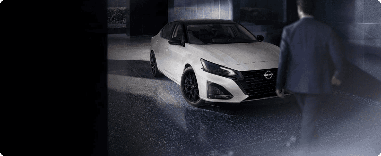 White 2026 Nissan Altima SR Midnight Edition with person walking