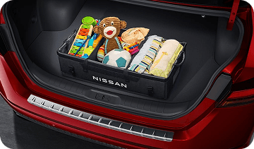 Cargo organizer with toys in red Altima trunk