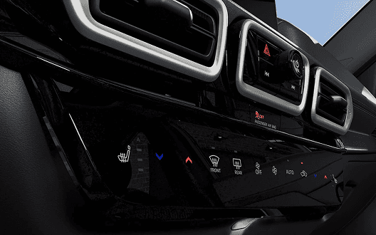 Close-up of Sentra climate controls and heated-seat button