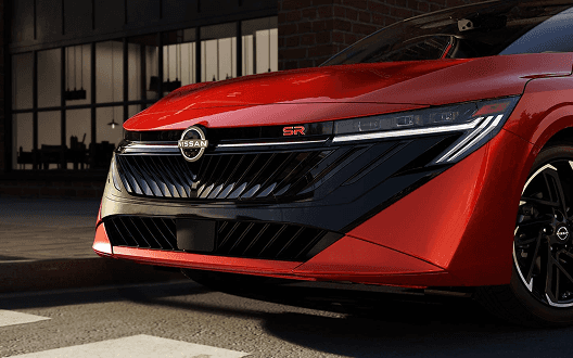 Close-up of red Sentra SR front grille and headlight