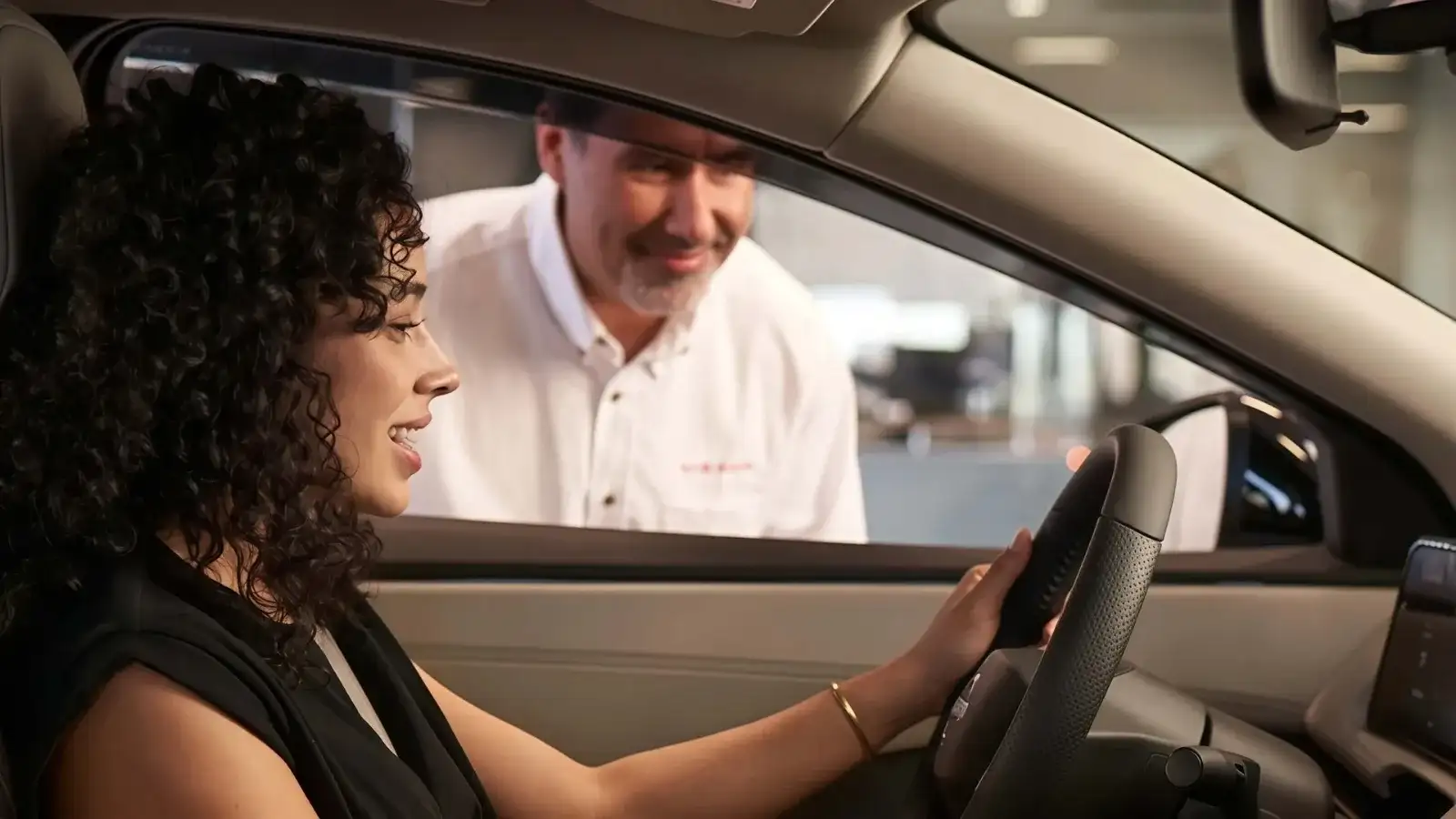 I-90 Nissan service technician working with a customer in Sheffield Village, Ohio
