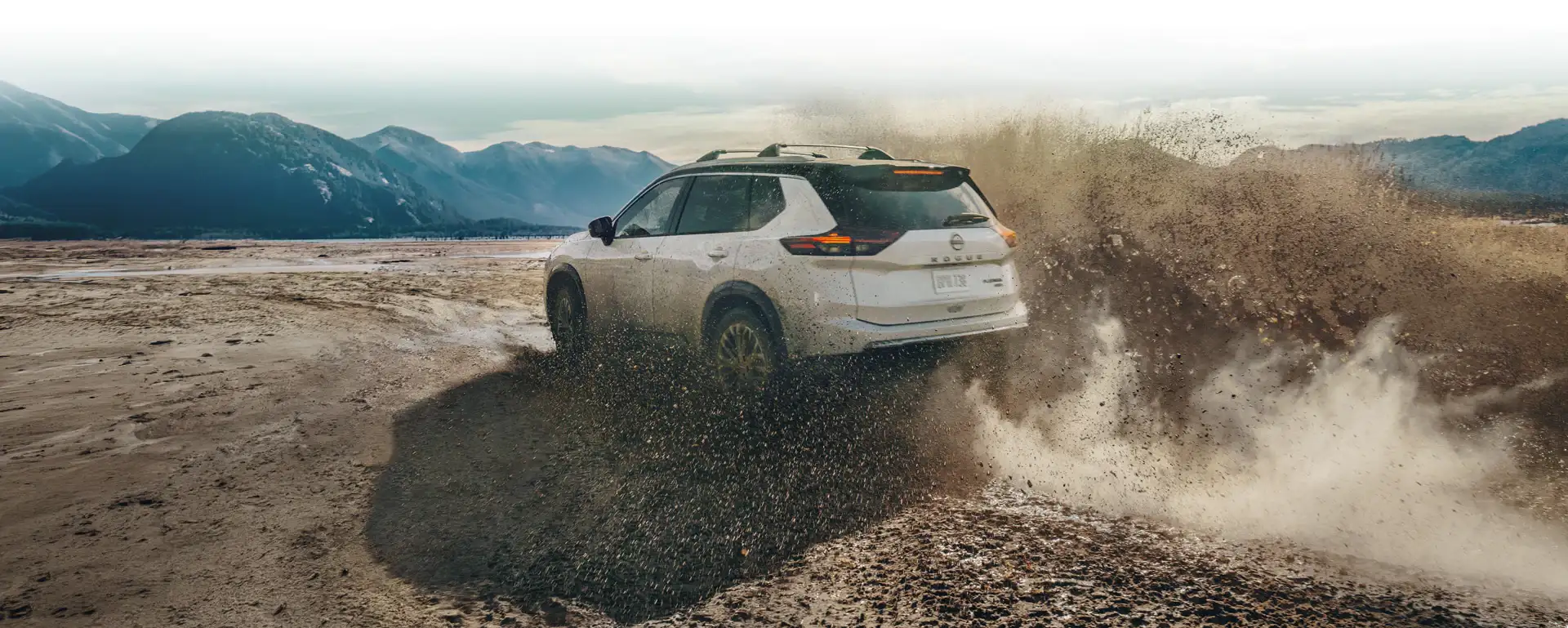 2026 Nissan Rogue on muddy terrain — the Xtronic CVT working under load, the kind of duty cycle that makes on-schedule transmission service matter