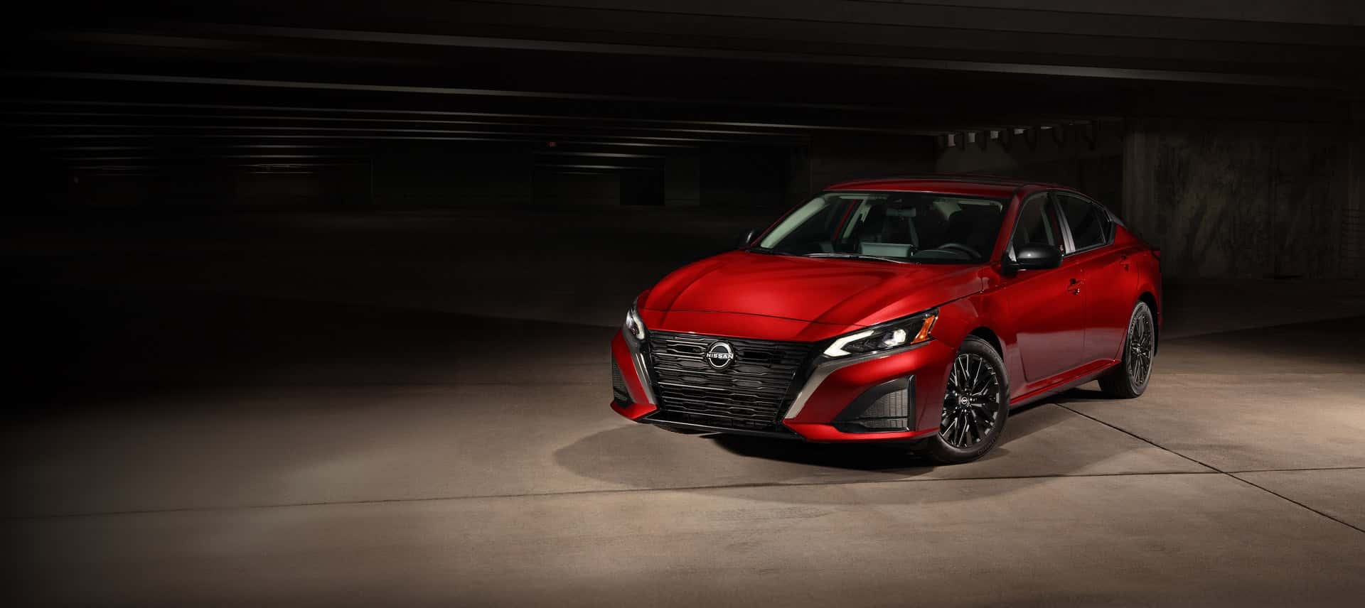 2026 Nissan Altima SR in red, side three-quarter view