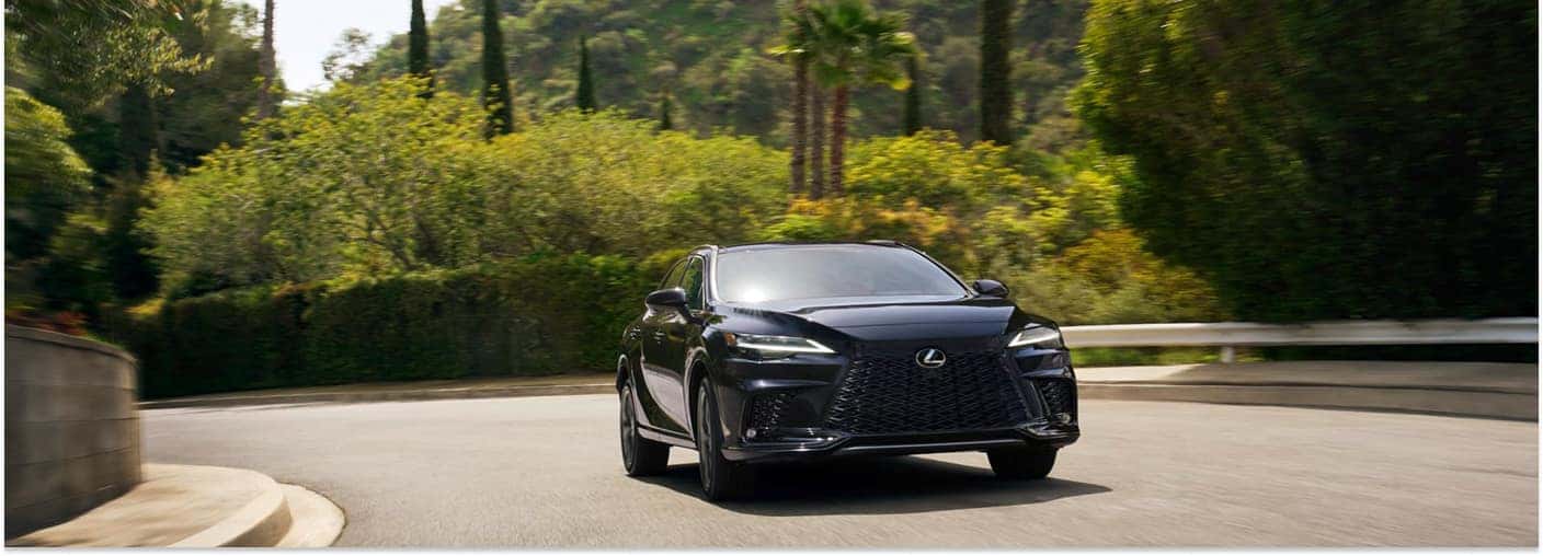 Dark Blue 2026 Lexus RX Driving on Road