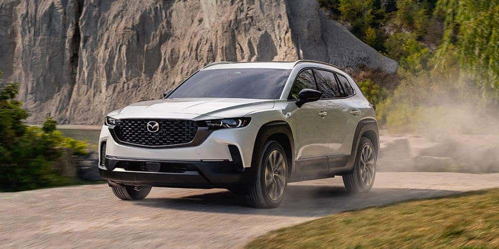 2025 Mazda CX-50 Hybrid Driving on Gravel Road