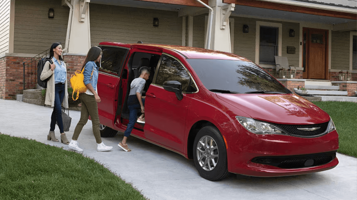Family getting into a Chrysler van