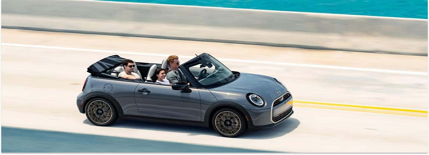 Gray 2026 MINI Convertible Driving on a Bridge Over Water