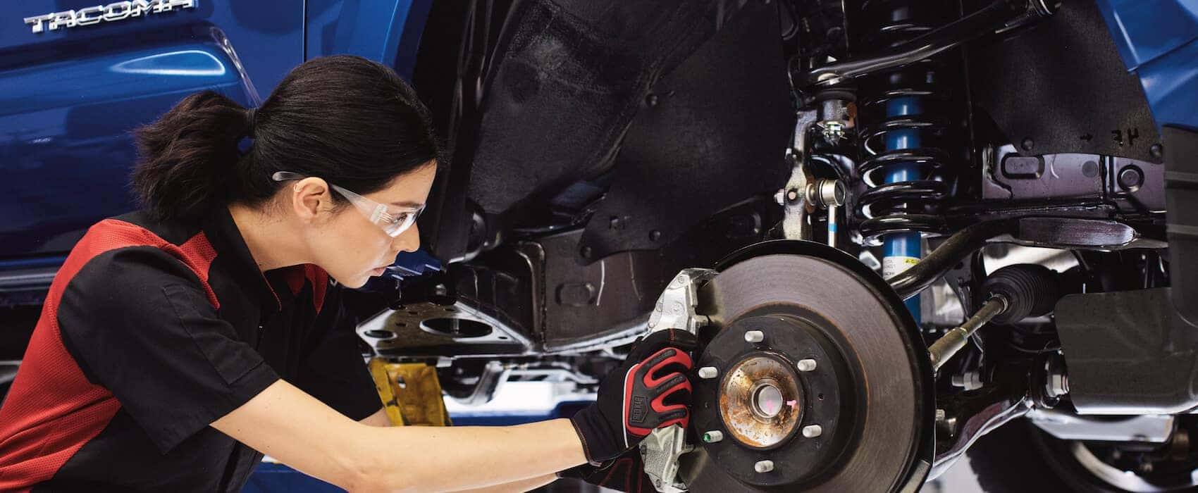 Toyota service employee working on car | Norm Reeves Toyota San Diego | Toyota auto Service near College Heights, CA 