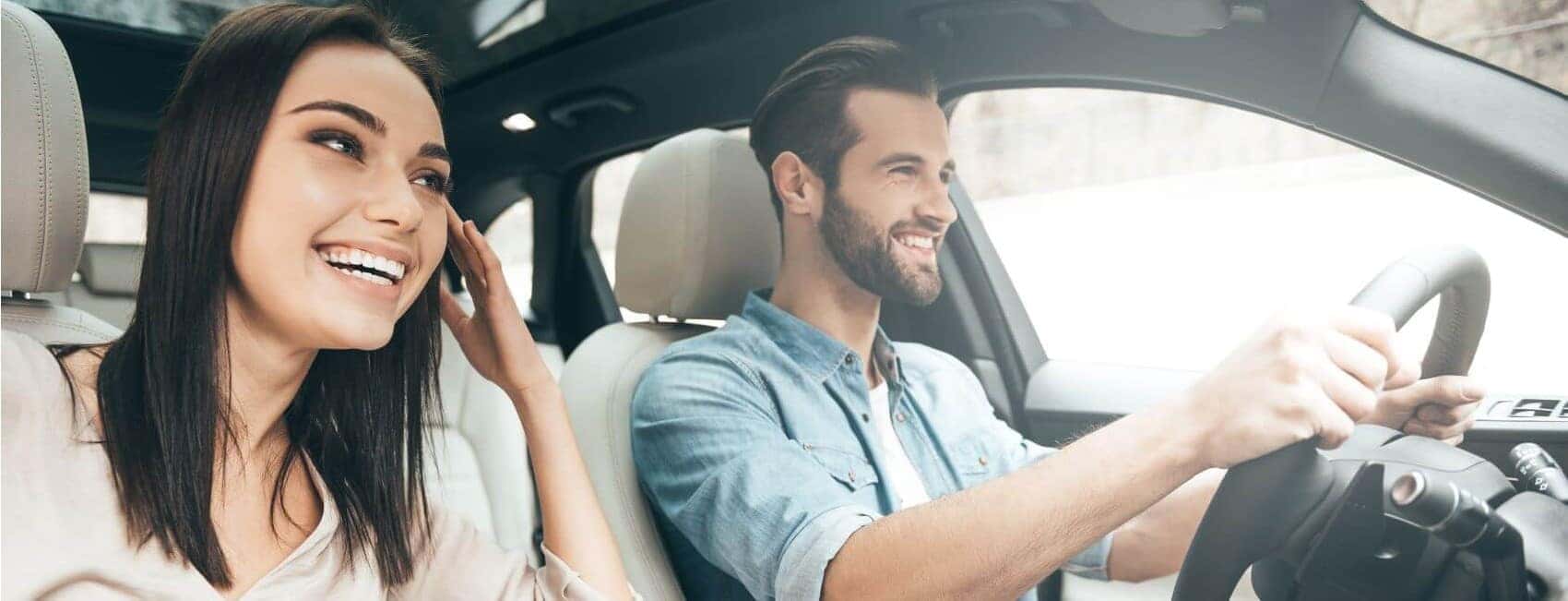 Couple in Luxury Vehicle Snipped